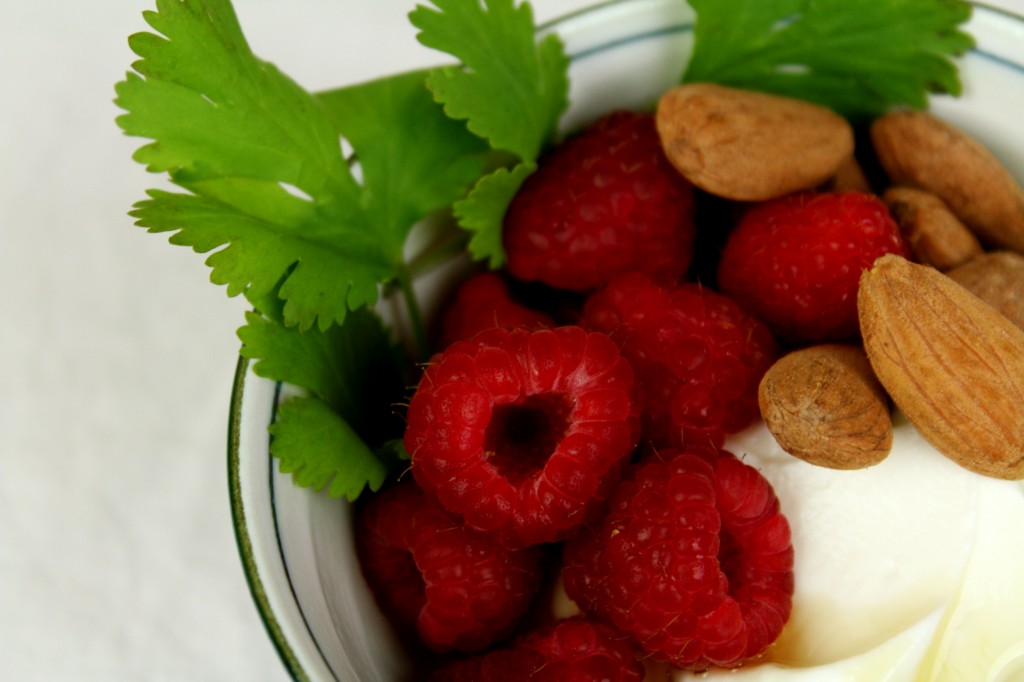 fresh raspberries w/ honey and roasted almonds over Greek yoghurt